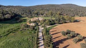 an aerial view of a house in a field with a train at La Casa dei Mandorli in Talamone