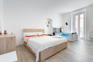 a bedroom with a large bed and a bathroom at Suite N12 - Luxury Apartment in Bari
