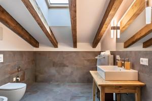a bathroom with a sink and a toilet at Chalet’s Samer in Sarntal +32 photos