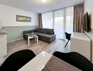 a living room with a couch and a table at Apartment 5 in Rielasingen-Worblingen