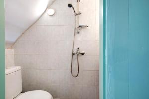 a bathroom with a shower with a toilet at Sira Stonehouse lll in Volímai