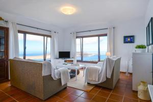 a living room with a view of the ocean at Casa Vereda del Risco in Ye