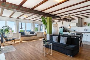 a living room with a couch and a table at Augensteins Burgzimmer in Seelbach