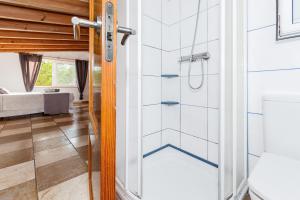 a pivot door in a room with a bathroom at Chalet Es Llossar in Cala en Blanes +19 photos