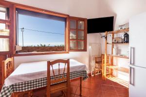 a small room with a table and a window at Casa Victor - Apartment 2 in La Orotava