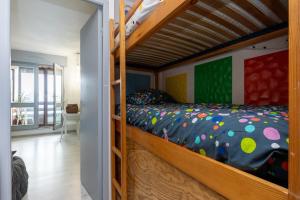 a bedroom with a bunk bed in a room at Location Noly in Seignosse