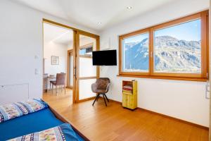 a bedroom with a view of a mountain at Ferienwohnung 3 Weger in Andrian