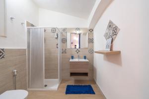 a bathroom with a shower and a sink at Villa Leale Plemmirio con piscina in Syracuse +27 photos