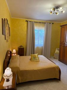 a bedroom with a bed and a window at Villa Nino in Petacciato +35 photos