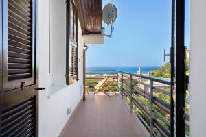 a balcony with a view of the ocean at Attico Con Vista in Moneglia