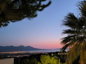 a view of the city at sunset from the hills at Lavender Residence in Kuşadası