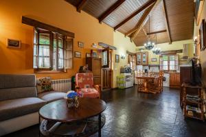 a living room with a couch and a table at Maseda 1 in Villayón