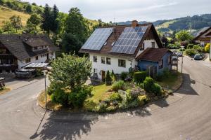 a house with solar panels on the roof at Furtwengler in Oberharmersbach