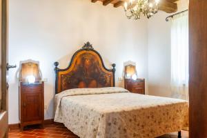 a bedroom with a large bed and two night stands at Il Cancellone - Tartaruga in Montiano +22 photos