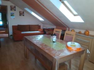 a living room with a table and a couch at Schwäbische Alb in Gomadingen