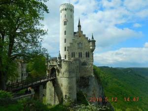 a castle on top of a hill with a bridge at Schwäbische Alb in Gomadingen +18 photos