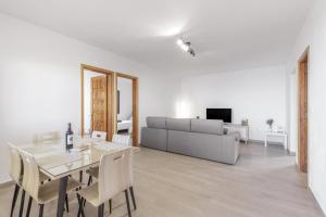 a living room with a dining table and a couch at Casa Tajinaste in Tijarafe