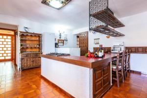 a kitchen with a large island in a room at Villa Monbijou in Vinarós