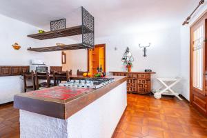 a kitchen with a counter with a stove top oven at Villa Monbijou in Vinarós