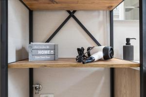 a shelf with a home appliance on it at A Casa Mia Prada vacanza di relax in Prada
