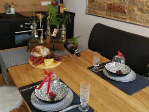 a table with two plates of food on top of it at Ferienwohnung Gugel, 48qm in Kandern