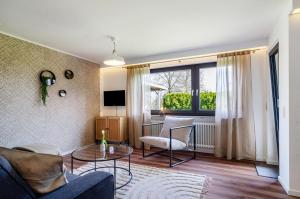 a living room with a couch and a table at Ferienwohnung Reichle in Stockach