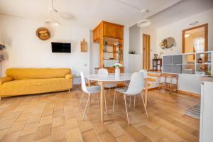 a living room with a table and a couch at Villa Costa Paradiso del Sud in Costa Rei