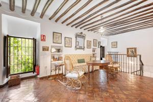 a living room with a table and a couch at Cortijo Caracate in Archidona