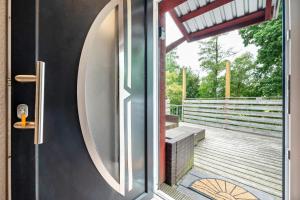 a door to a deck with a bench on it at Zum Kanal in Steinau