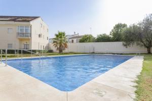 a swimming pool in the backyard of a house at Villa Gallardo in Campillos