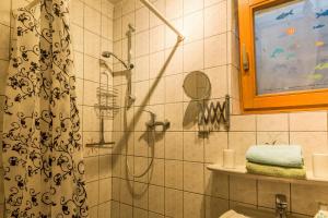 a bathroom with a shower with a shower curtain at Ferienwohnung Alina in Singen +20 photos