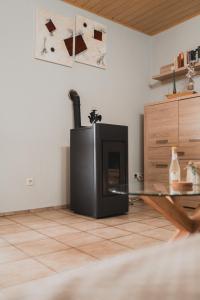 a living room with a fireplace and a glass table at Ferienwohnungen Bullau - 2 in Erbach +11 photos