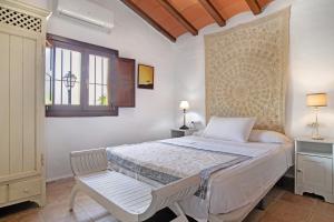 a bedroom with a bed and a window at Casa De Los Pintores Facinas in Facinas +24 photos