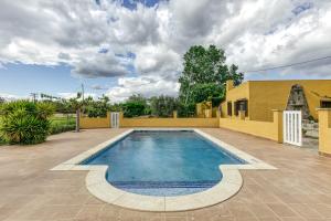 a swimming pool in the middle of a yard at Les Cabretes Vilanova de la Muga in Vilanova de la Muga