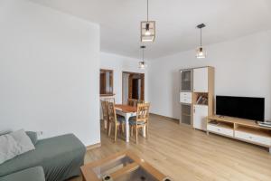 a living room with a couch and a table at Casa Palmar La Gomera in Valle Gran Rey