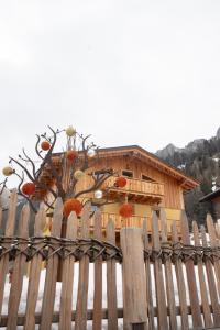 a wooden fence in front of a house at Alla Vecchia Dogana in Misurina