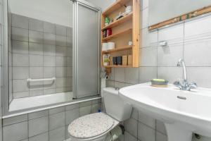 a bathroom with a toilet and a sink and a shower at Maison Collo in Collobrières +15 photos