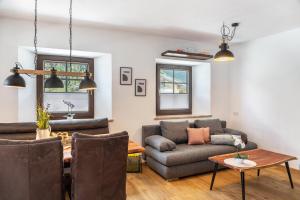 a living room with a couch and a table at Apart Celina in Oetz