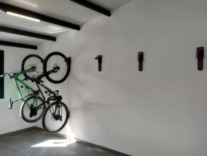 a bike hanging on a wall in a room at El Alarife in Sediles
