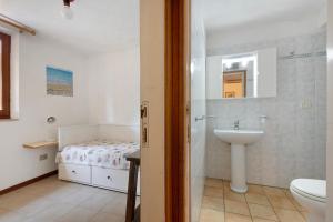 a bathroom with a sink and a toilet at Hause Sant'Ilario in Campo nell'Elba +71 photos