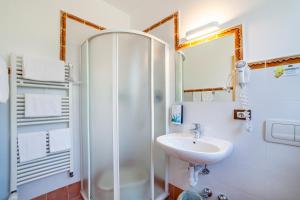 a bathroom with a shower and a sink at Gartenheim App Franz in Schenna +16 photos