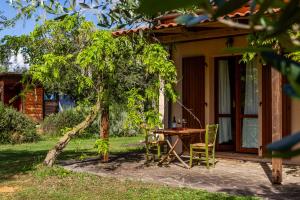 a table and chairs in front of a house at Il Gaggiolo 2 in Grosseto