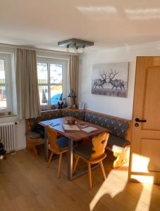 a dining room with a table and chairs at Apartment Blackforest-Schluchsee in Schluchsee