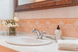 a bathroom sink with a soap dispenser on a counter at Els Marsals in Llucmajor +24 photos