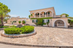 a large house with a garden in front of it at Els Marsals in Llucmajor