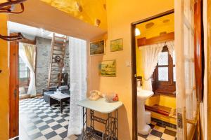 a bathroom with a sink and a toilet in a room at Casa Rústica San Francisco 1 in Telde