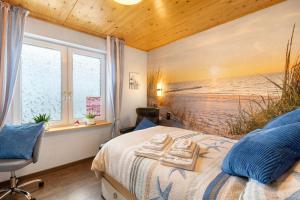 a bedroom with a bed with two towels on it at Ferienwohnung Haus Luise in Olsberg