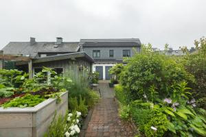 a house with a garden in front of it at Ferienwohnung Haus Luise in Olsberg