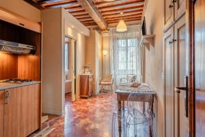 a kitchen with a island in the middle of a room at Romantic Apartment Near Pisa Lucca in Bientina