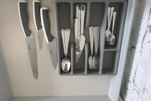 a drawer filled with utensils in a refrigerator at La Maison Defanny - 2 in Muides-sur-Loire